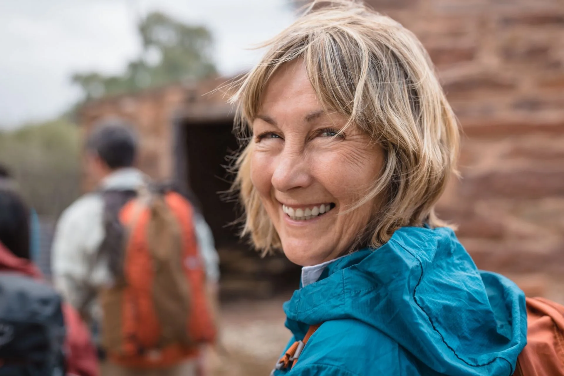 A smiling self-guided walker on the trail
