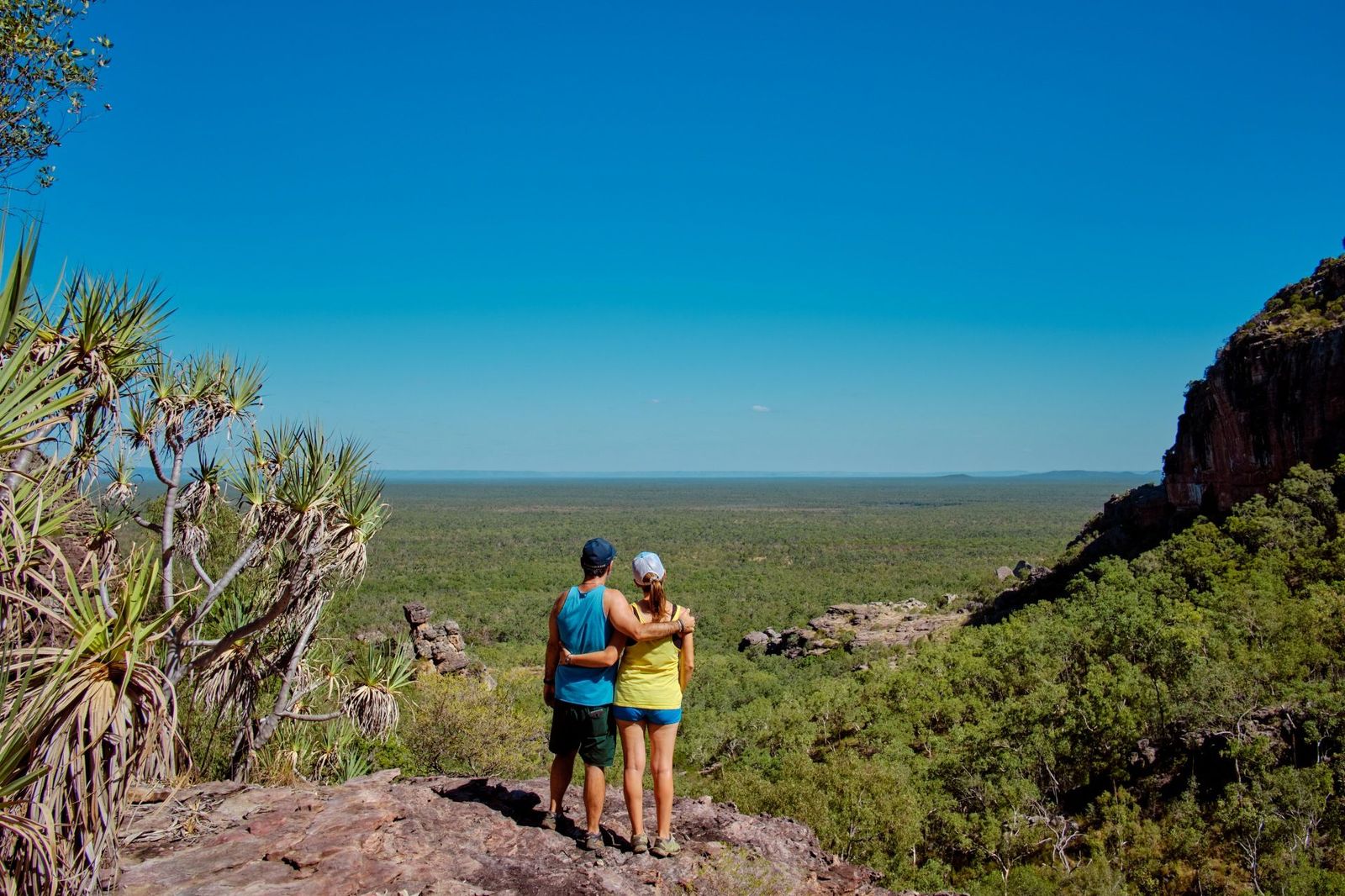Couple standing on a rocky ledge at Gunwarddehwarde Lookout
