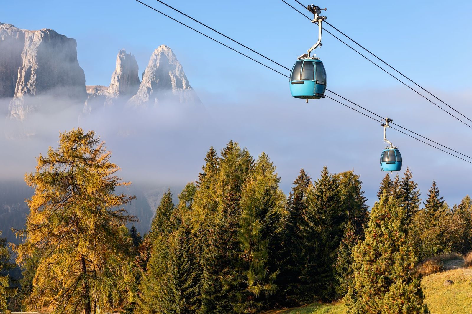 Gondolas-Gliding-Over-an-Autumn-Forest-in-Dolomites