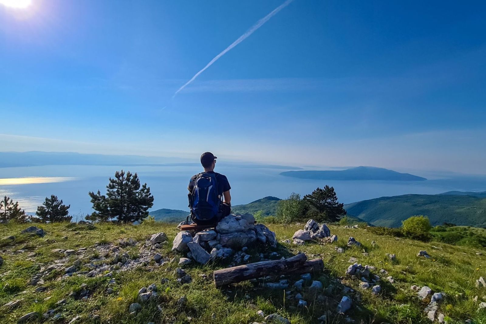 Hiker at Vojak Lookout overlooking the Istrian coast and islands