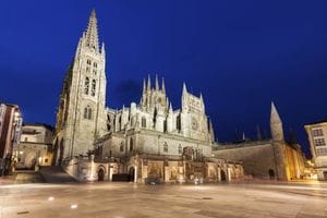 Burgos Cathedral on Plaza de San Fernando seen at night.