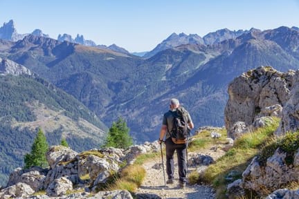 Active,Senior,Caucasian,Man,Hiking,In,Dolomiti,Mountains,With,Backpack,