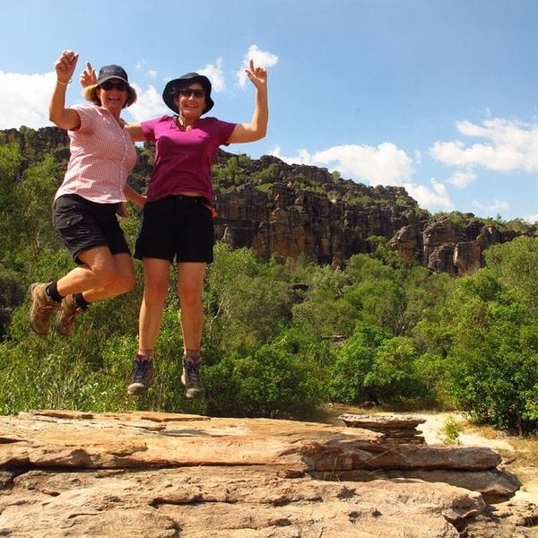 Hikers jumping Top End Timeless North