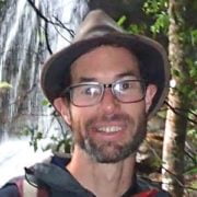 Portrait photo of Auswalk guide Rick Webb guiding a hike in the Gold Coast Hinterland